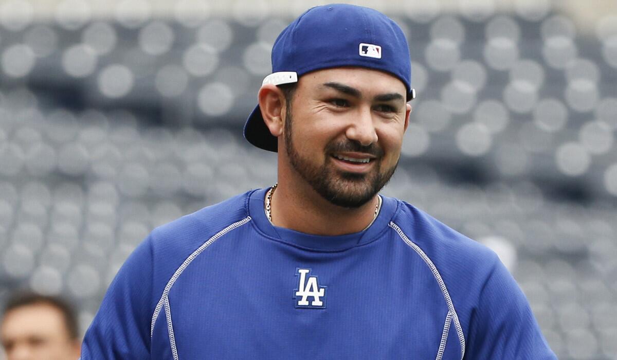 Los Angeles Dodgers first baseman Adrian Gonzalez smiles during warmups before a game against the San Diego Padres on Friday.