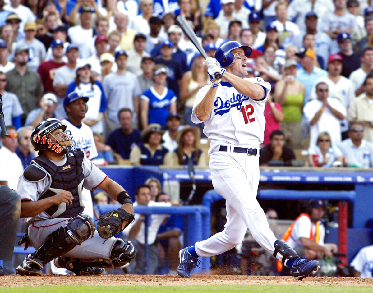 Dodgers' Steve Finley follows through for a grand slam in the bottom of the ninth inning against the San Francisco Giants.