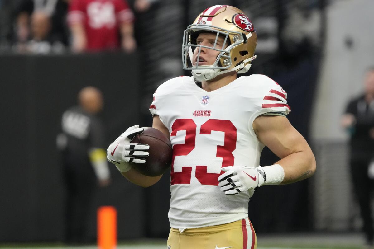 San Francisco 49ers running back Christian McCaffrey runs the ball against the Las Vegas Raiders.