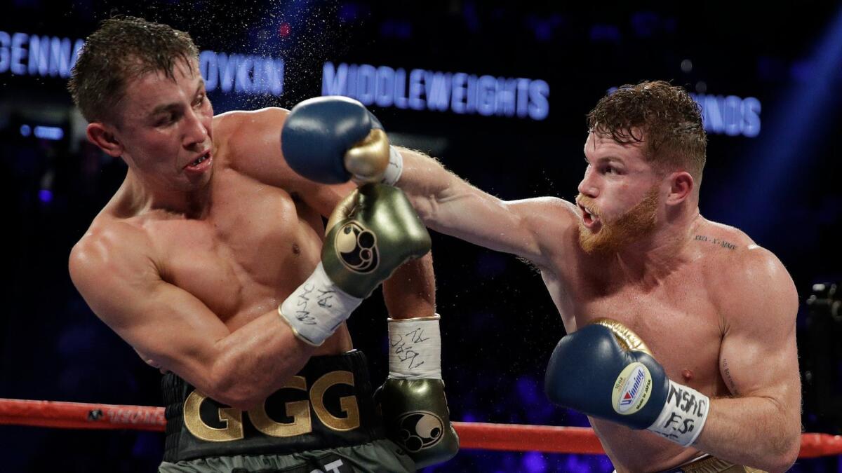 Canelo Alvarez throws a punch at Gennady Golovkin during their 2017 middleweight title fight in Las Vegas. There's a push to have five judges ringside for major championship bouts.