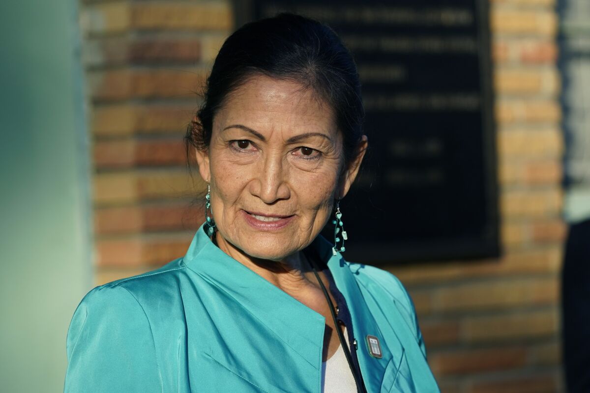 Secretary of the Interior Deb Haaland speaks with reporters about visiting several communities and sites in Mississippi to honor individuals and events that advanced the Civil Rights Movement, while standing outside the Medgar and Myrlie Evers Home National Monument in Jackson, Miss., Tuesday, Feb. 15, 2022. (AP Photo/Rogelio V. Solis)