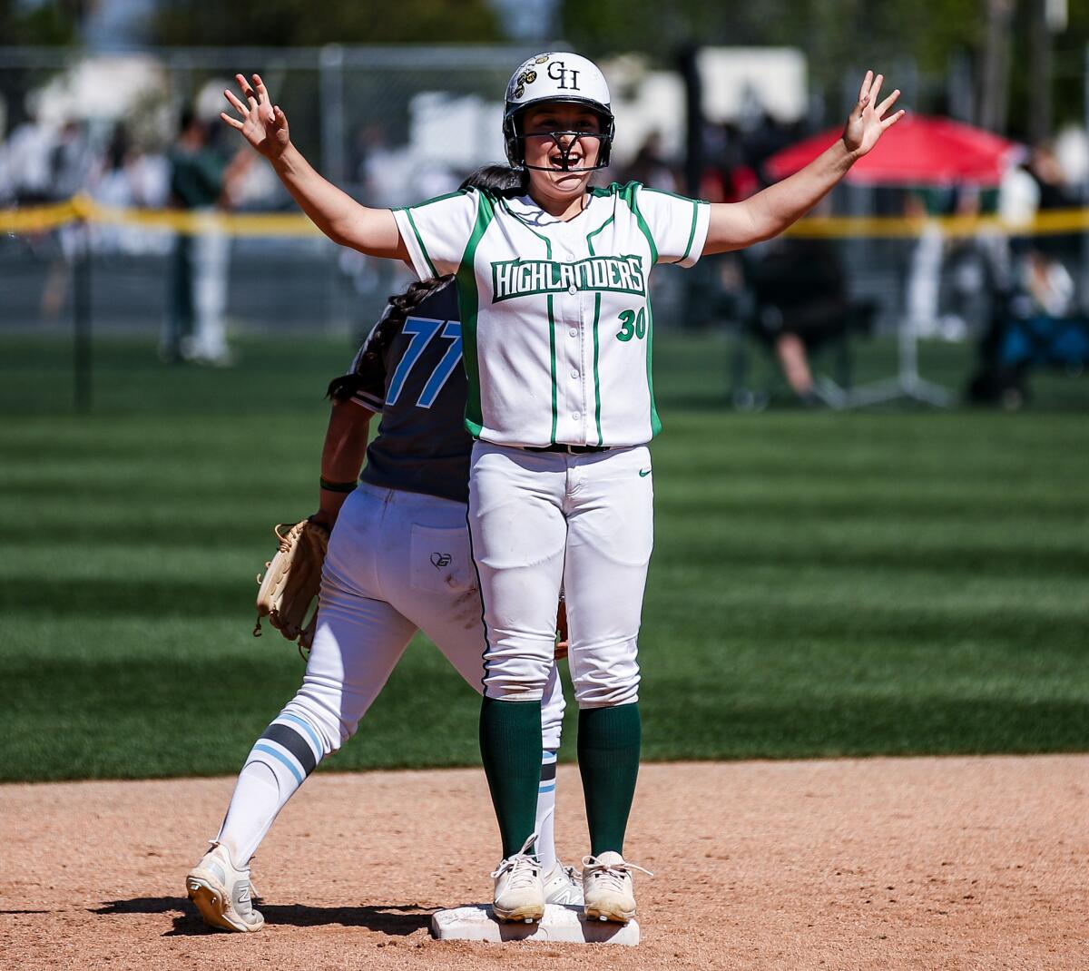 Jeannette Camarena of Granada Hills celebrates while standing on second base during a win over El Camino Real.