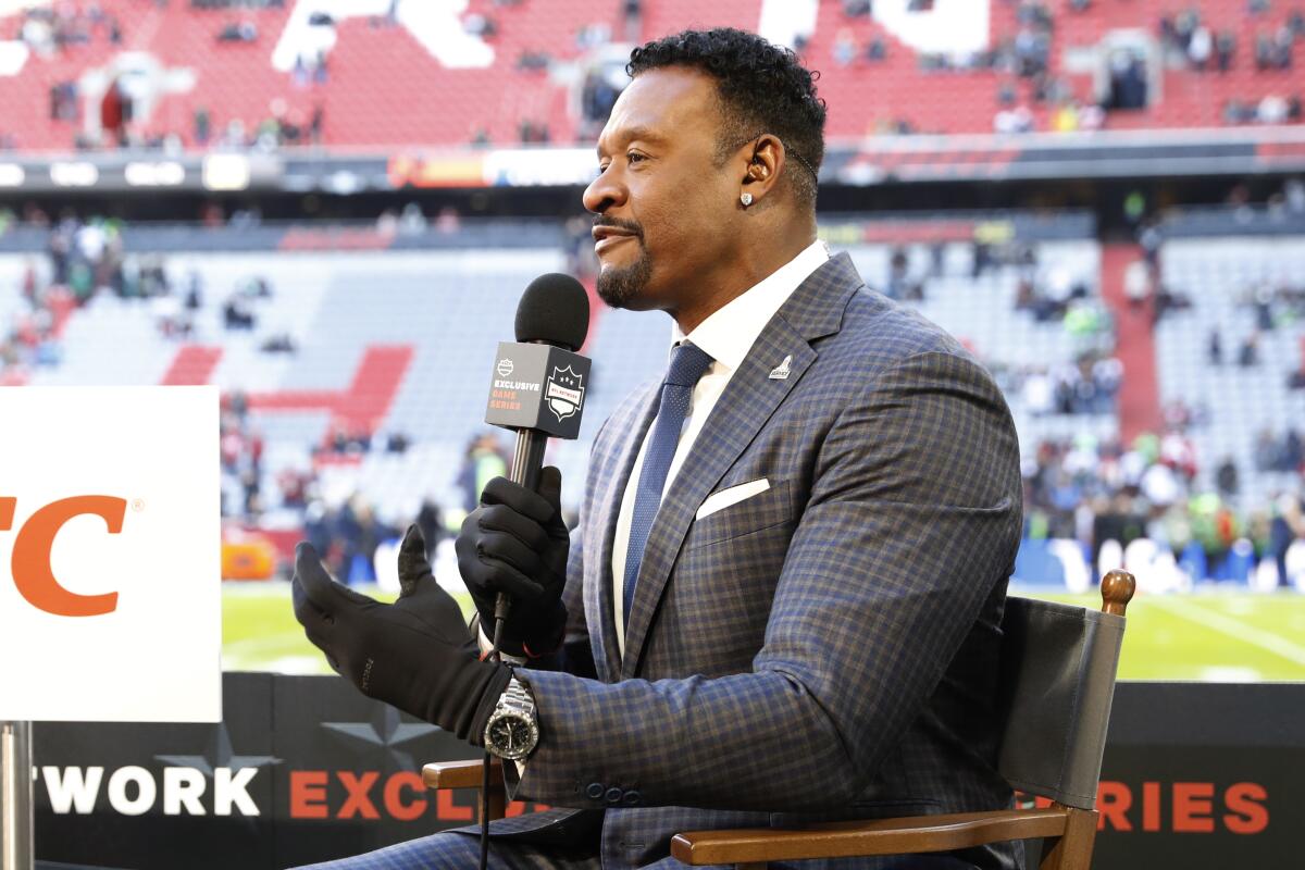 Willie McGinest reports from the sideline before an NFL football game on Nov. 13.