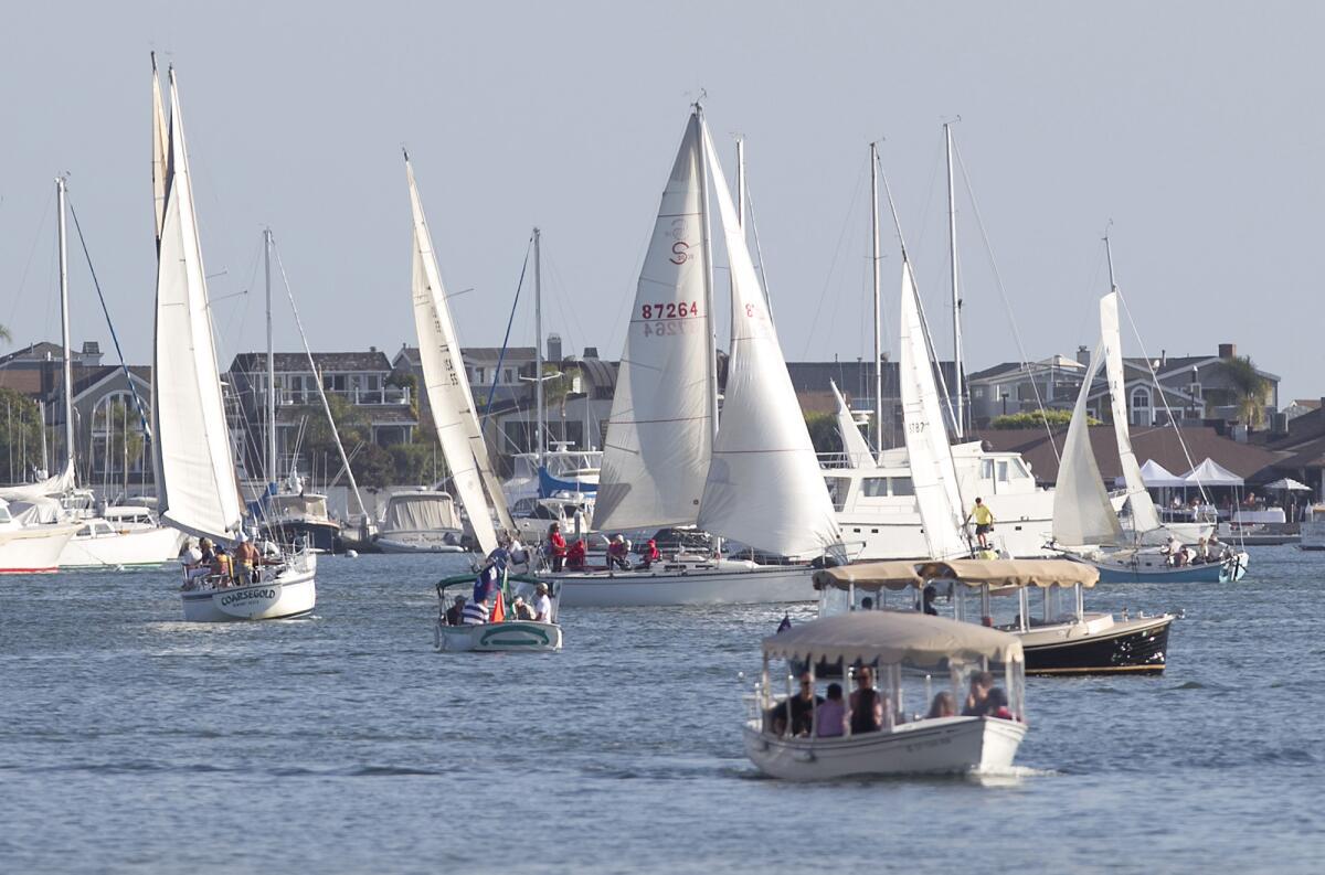 Water craft move through the Newport Harbor Turning Basin on Wednesday. The City Council approved a second anchorage in the basin.