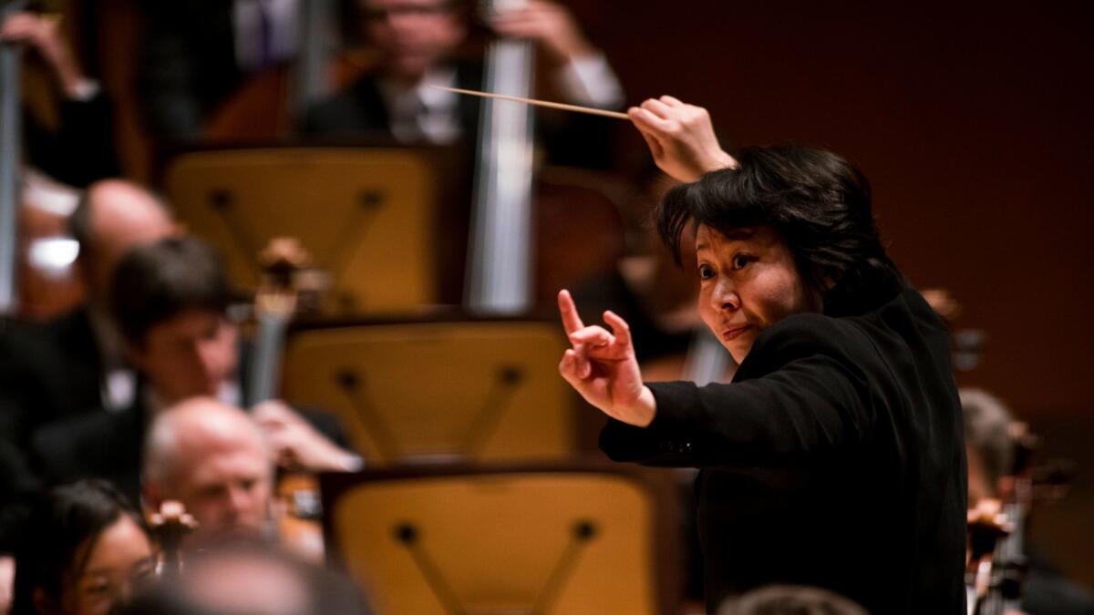 Xian Zhang conducts the Los Angeles Philharmonic in Chen Yi's "Ge Xu (Antiphony)" at Walt Disney Concert Hall on Friday morning.