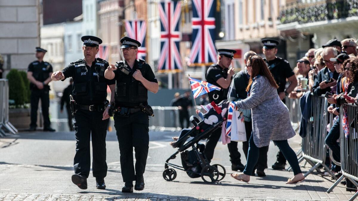 Police officers patrol outside Windsor Castle on May 17, 2018, ahead of a dress rehearsal of the wedding of Prince Harry and Meghan Markle.