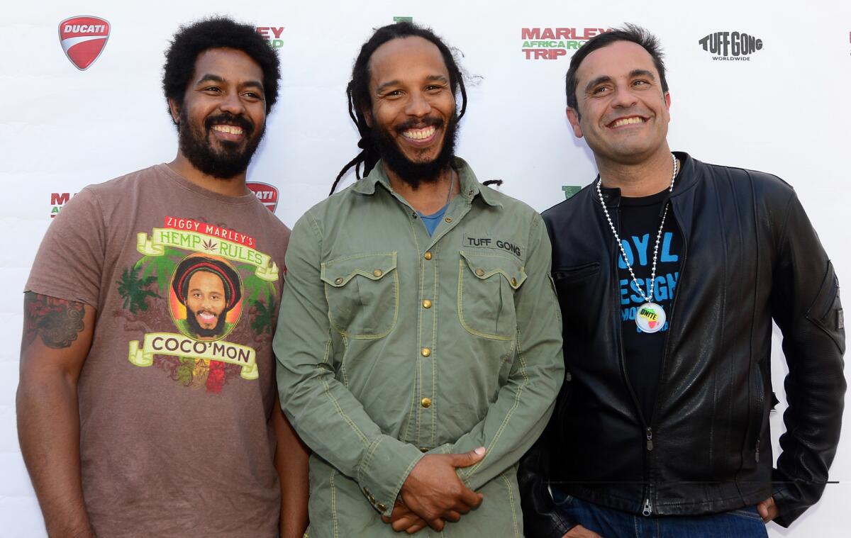 Robbie, left, and Ziggy Marley, children of legendary reggae artist Bob Marley, pose with director David Alexanian, right, at Newcomb's Ranch roadhouse on the Angeles Crest Highway. The trio arrived on motorcycles to support "Marley Road Trip South Africa 2010," a six-part documentary series that follows three of Bob's sons, Ziggy, Robbie and Rohan, as they travel to Africa 30 years after their father's passing.