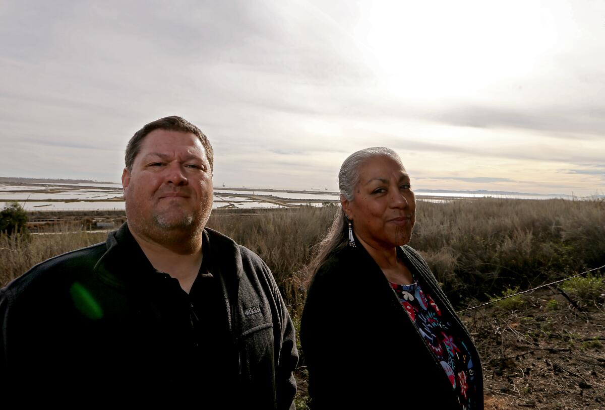  Dustin Murphey and Tina Calderon stand on coastal land that has been returned to indigenous tribes.