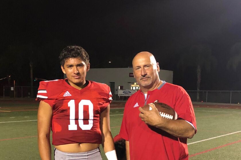 Rancho Verde quarterback AJ Duffy (left) and his father, coach Pete Duffy. AJ is transferring to IMG Academy in Florida.