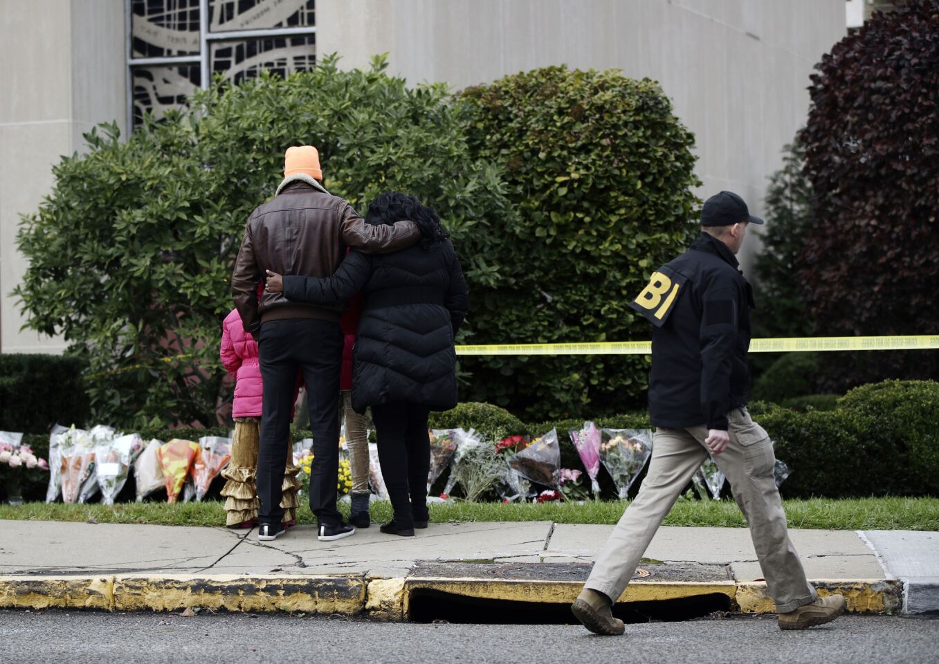 People pay their respects at a memorial outside the Tree of Life synagogue in Pittsburgh on Oct. 28, 2018.