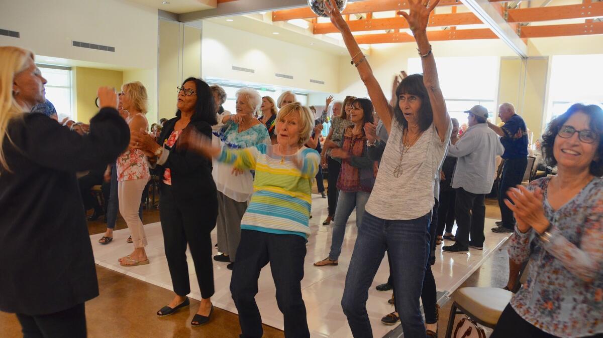 Dancing under the disco ball was the place to be on Saturday at OASIS Senior Center.