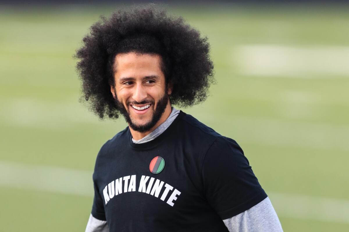 Colin Kaepernick smiles during a private NFL workout held in Georgia.
