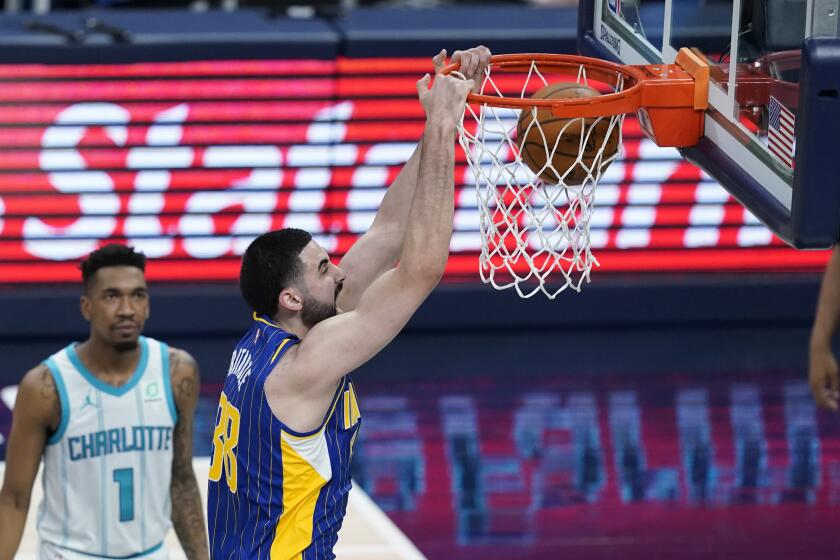 Indiana Pacers' Goga Bitadze dunks during the second half of the team's NBA basketball Eastern Conference play-in game against the Charlotte Hornets, Tuesday, May 18, 2021, in Indianapolis. (AP Photo/Darron Cummings)