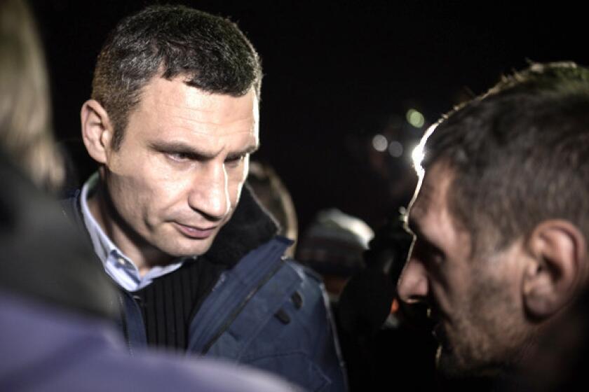Vitali Klitschko speaks to anti-government protesters at Independence Square in Kiev, Ukraine, on Friday.