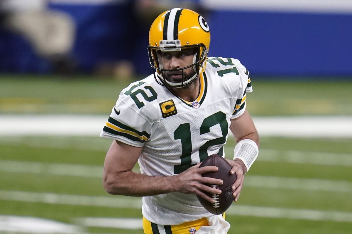 FILE - Green Bay Packers quarterback Aaron Rodgers looks to throw during the first half of an NFL football game against the Indianapolis Colts in Indianapolis, in this Sunday, Nov. 22, 2020, file photo. Rogers was selected Friday, Jan. 8, 2021, for The Associated Press NFL All-Pro Team. (AP Photo/Michael Conroy, File)