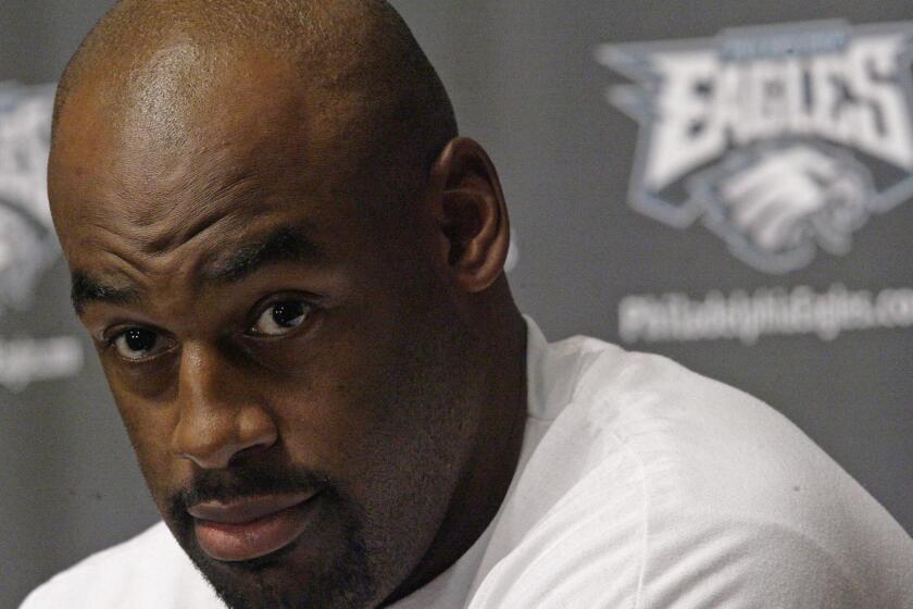 Philadelphia Eagles quarterback Donovan McNabb addresses a news conference in Philadelphia, Wednesday, Sept. 19, 2007. A perplexed McNabb didn't back down from his comment that black quarterbacks face greater scrutiny than their white counterparts, saying "it's just reality." (AP Photo/Matt Rourke) ORG XMIT: PX102