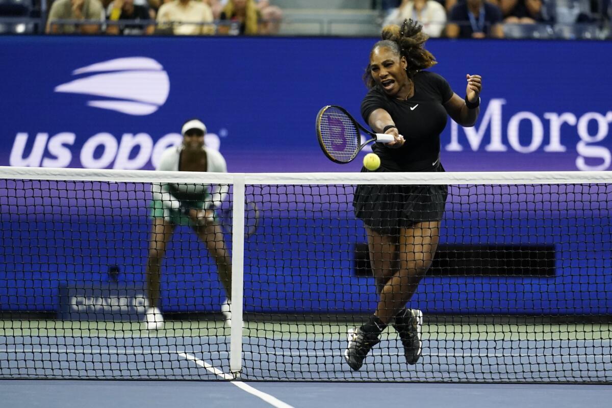 Serena Williams, of the United States, returns a shot during her first-round doubles match with Venus Williams, against Lucie Hradecká and Linda Nosková, of the Czech Republic, at the U.S. Open tennis championships, Thursday, Sept. 1, 2022, in New York. ( (AP Photo/Charles Krupa)