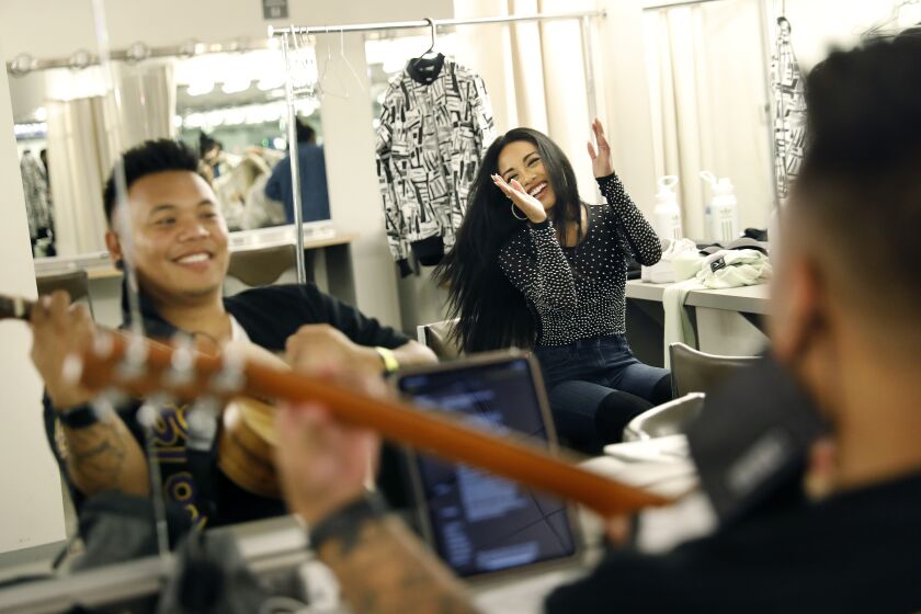 LOS ANGELES-CA-AUGUST 29, 2021: AJ Rafael, left, and Jules Aurora sing a song together in the dressing room before A Night of "Pinoy"tainment, a celebration of Filipino American talent, at The Ford in Los Angeles on Sunday, August 29, 2021. (Christina House / Los Angeles Times)