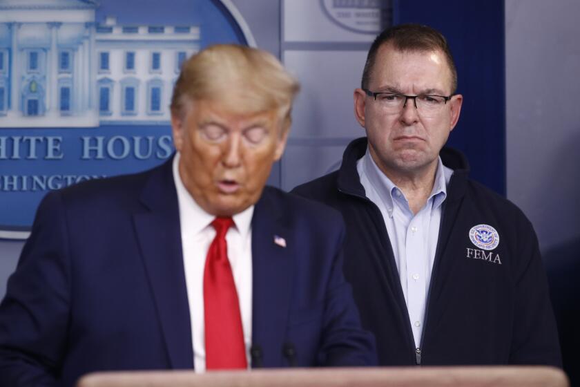 FEMA administrator Peter Gaynor listens as President Donald Trump speaks during a coronavirus task force briefing at the White House, Sunday, March 22, 2020, in Washington. (AP Photo/Patrick Semansky)