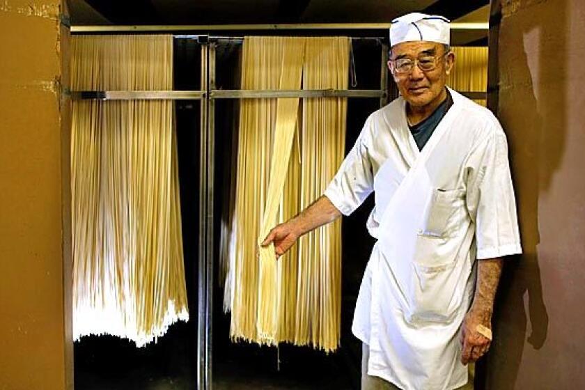 Owner Shoichi Sayano shows off one of his noodle drying closets at Nanka Seimen Noodle Co. in Vernon.