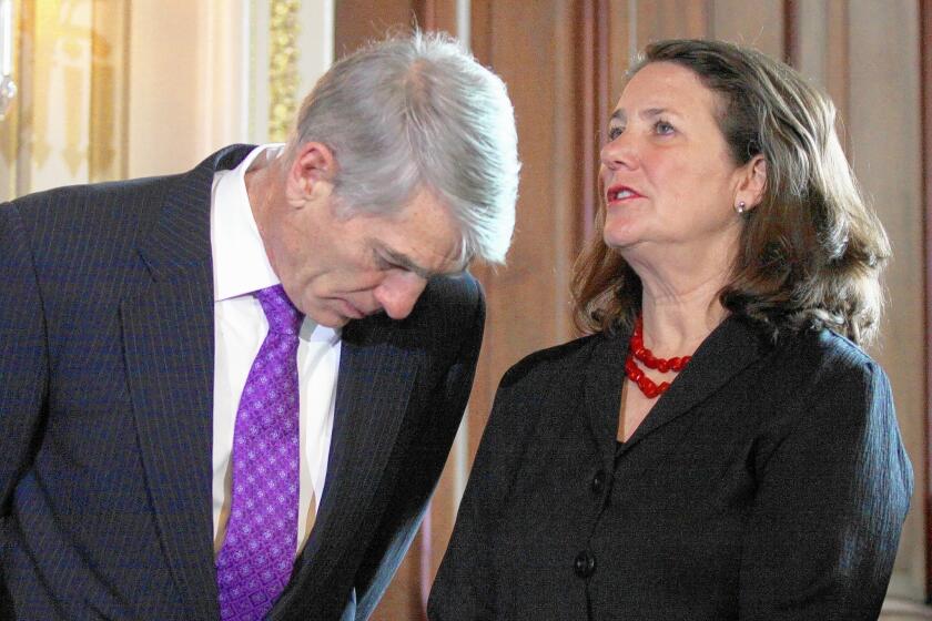 Sen. Mark Udall (D-Colo.) speaks to Rep. Diana DeGette (D-Colo.) on Capitol Hill.