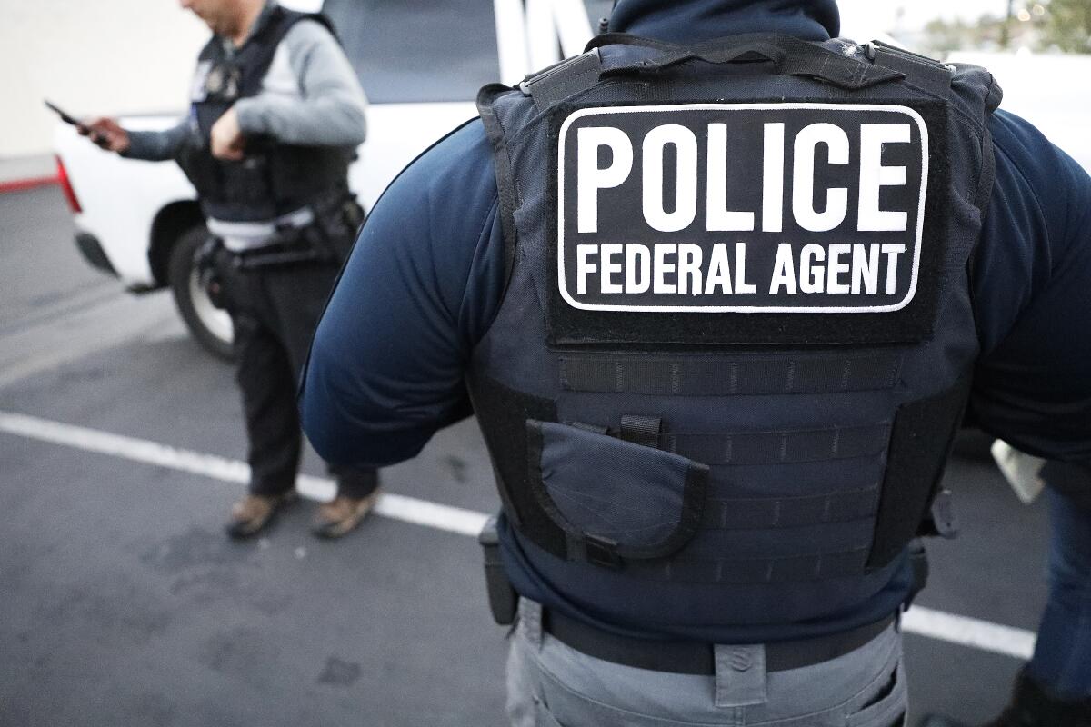 Two U.S. Immigration and Customs Enforcement officers.