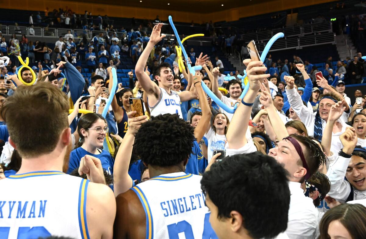 UCLA's Jaime Jaquez Jr. celebrates with the crowd at Pauley Pavilion after the Bruins' 69-64 win over Arizona on Saturday.