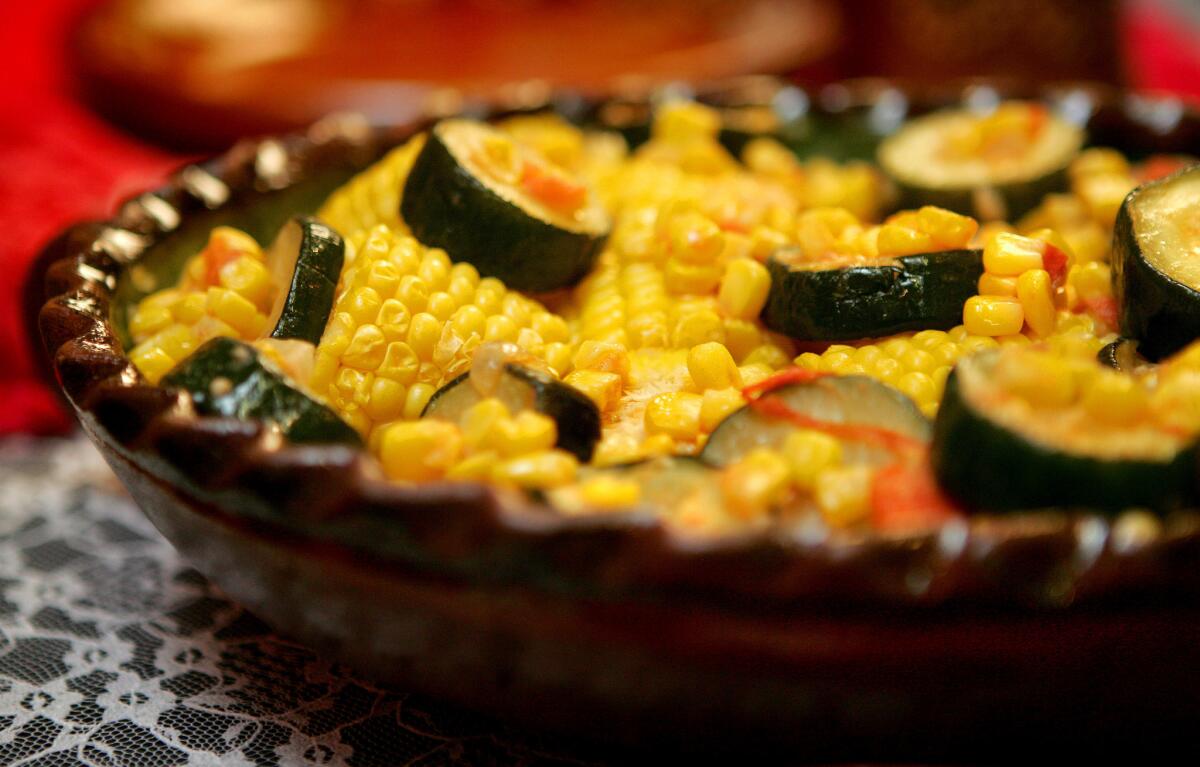 HARVEST: A homey dish of stewed zucchini, corn and tomatoes is all part of the holiday.