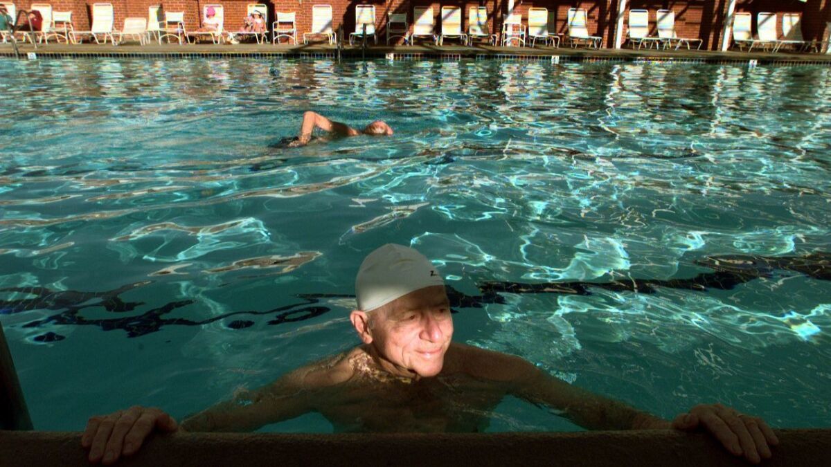 Leisure World resident Jerry Wyss enjoys the pool in 1999.