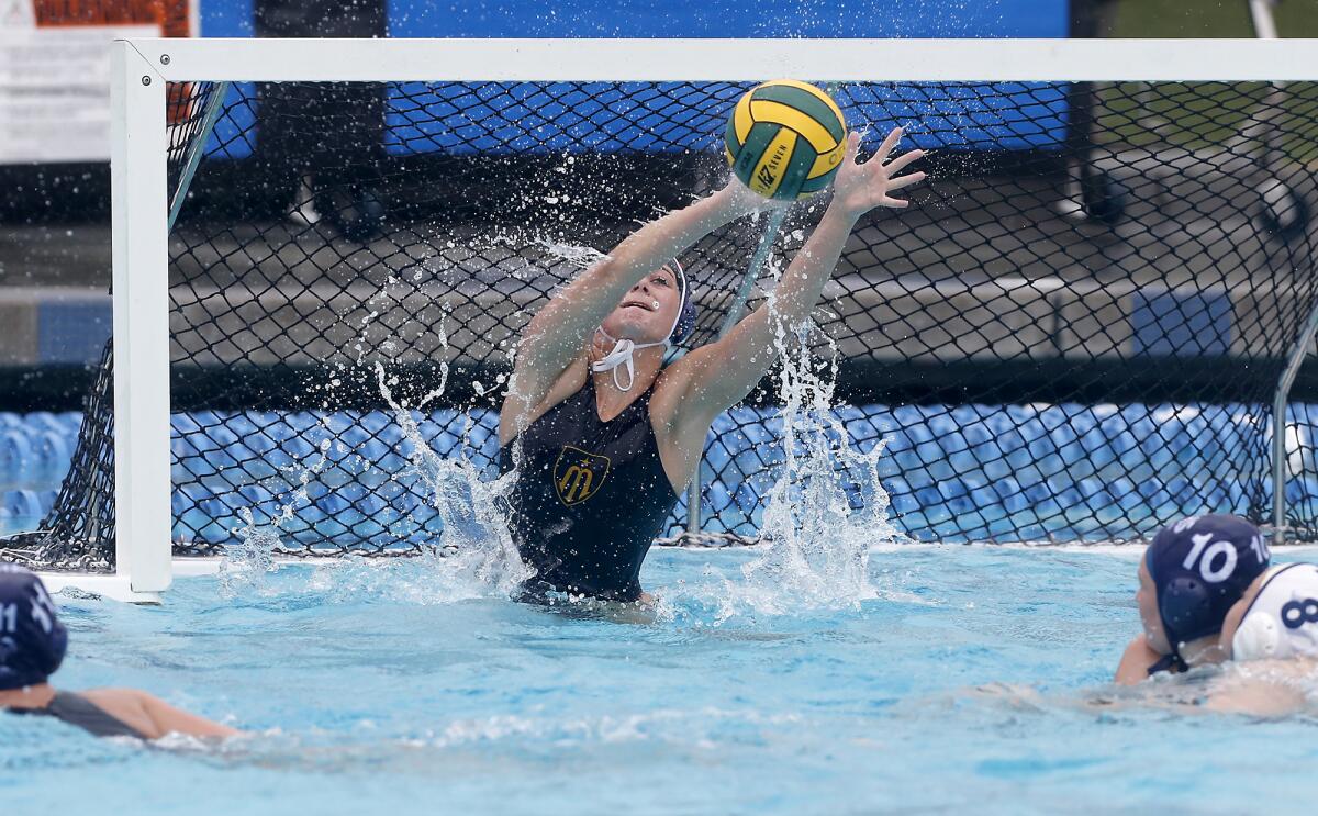 Marina goalkeeper Emma Marsh makes a save during the second half against Flintridge Prep in the CIF Southern Section Division 6 championship match at Woollett Aquatics Center in Irvine on Saturday.