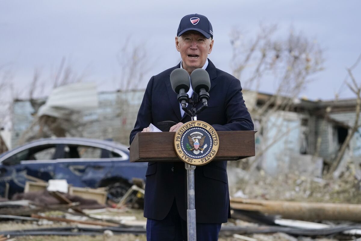 President Joe Biden speaks after surveying storm damage from tornadoes and extreme weather in Dawson Springs, Ky., Wednesday, Dec. 15, 2021. (AP Photo/Andrew Harnik)