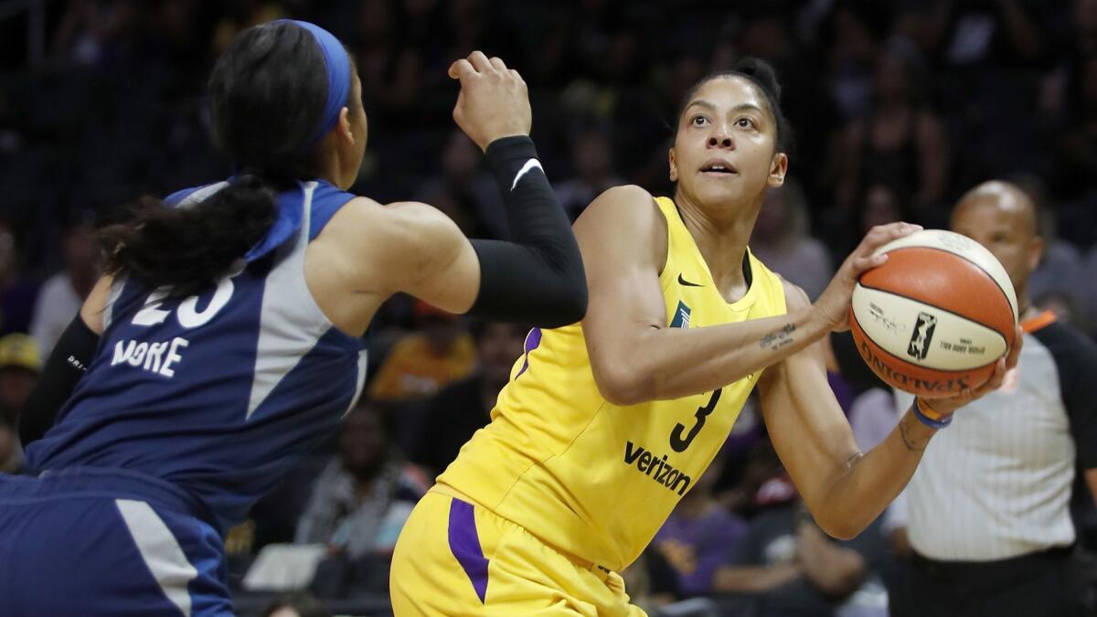 The Sparks' Candace Parker shoots against the Lynx's Maya Moore during a game in August.