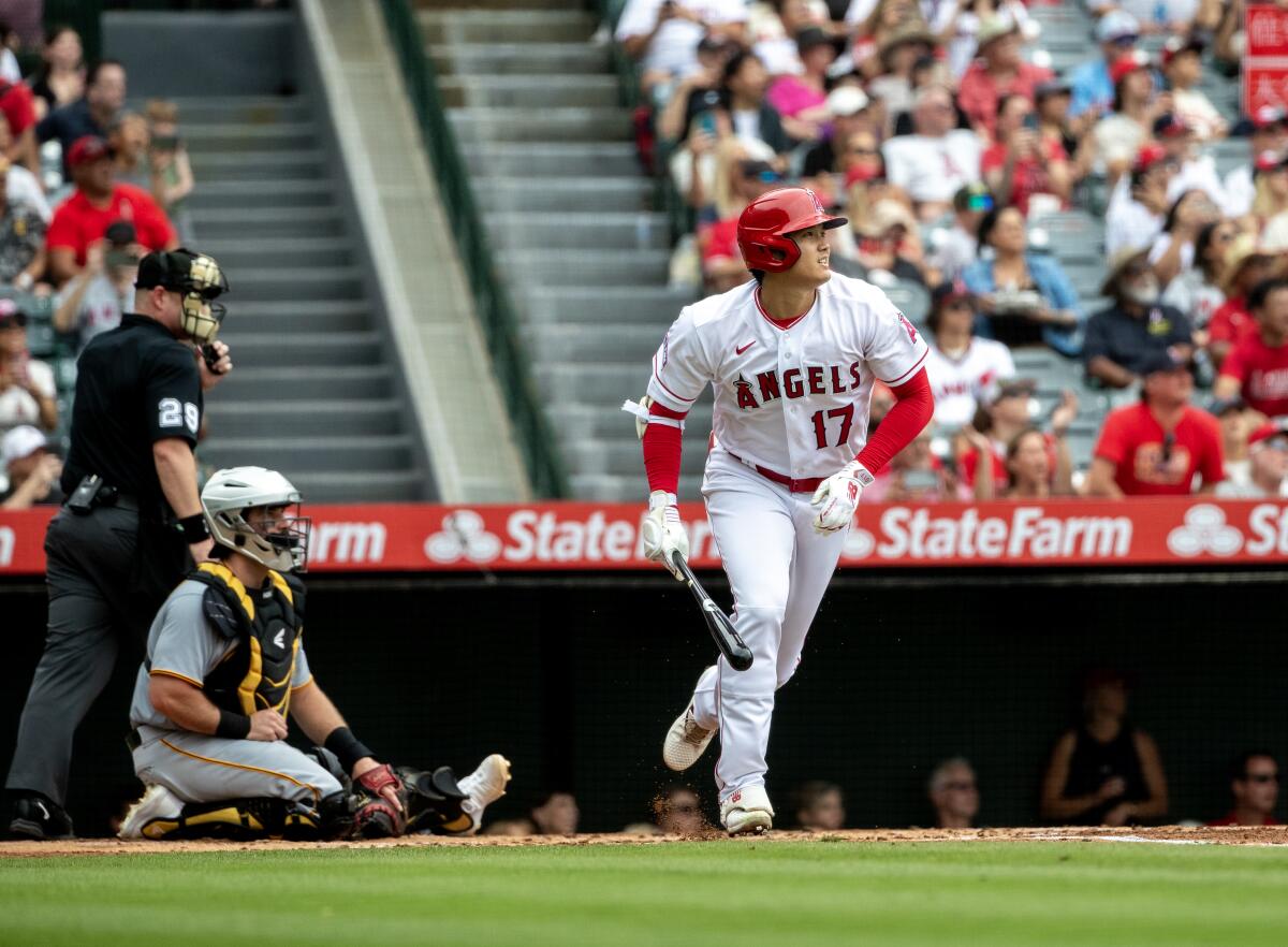 Angels designated hitter Shohei Ohtani watches his home run against the Detroit Tigers on July 23, 2023, at Angel Stadium.