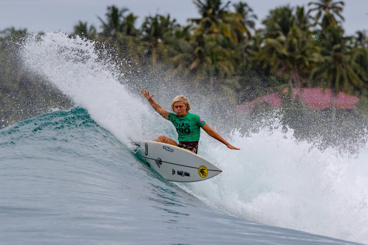 Ella McCaffray surfs in Indonesia.