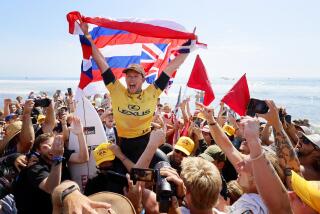 SAN CLEMENTE, CA SEPT. 6, 2024 - Hawaiii's John John Florence is carried off the sand after beating Brazilian Italo Ferreira during the Lexus WSL Finals at Lower Trestles in San Clemente on September 6, 2024. (Allen J. Schaben / Los Angeles Times)