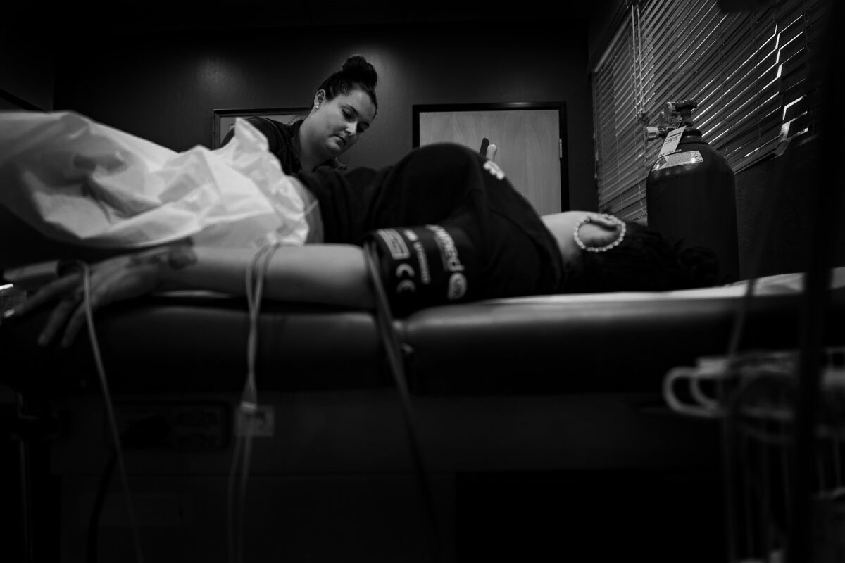 The nurse monitors the patient's ultrasound before the abortion procedure in Phoenix. (Gina Ferazzi / Los Angeles Times)