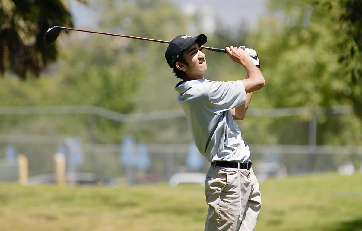Jahan Battu of Granada Hills hits his tee shot down the middle of the fairway en route to a birdie on the 18th hole.