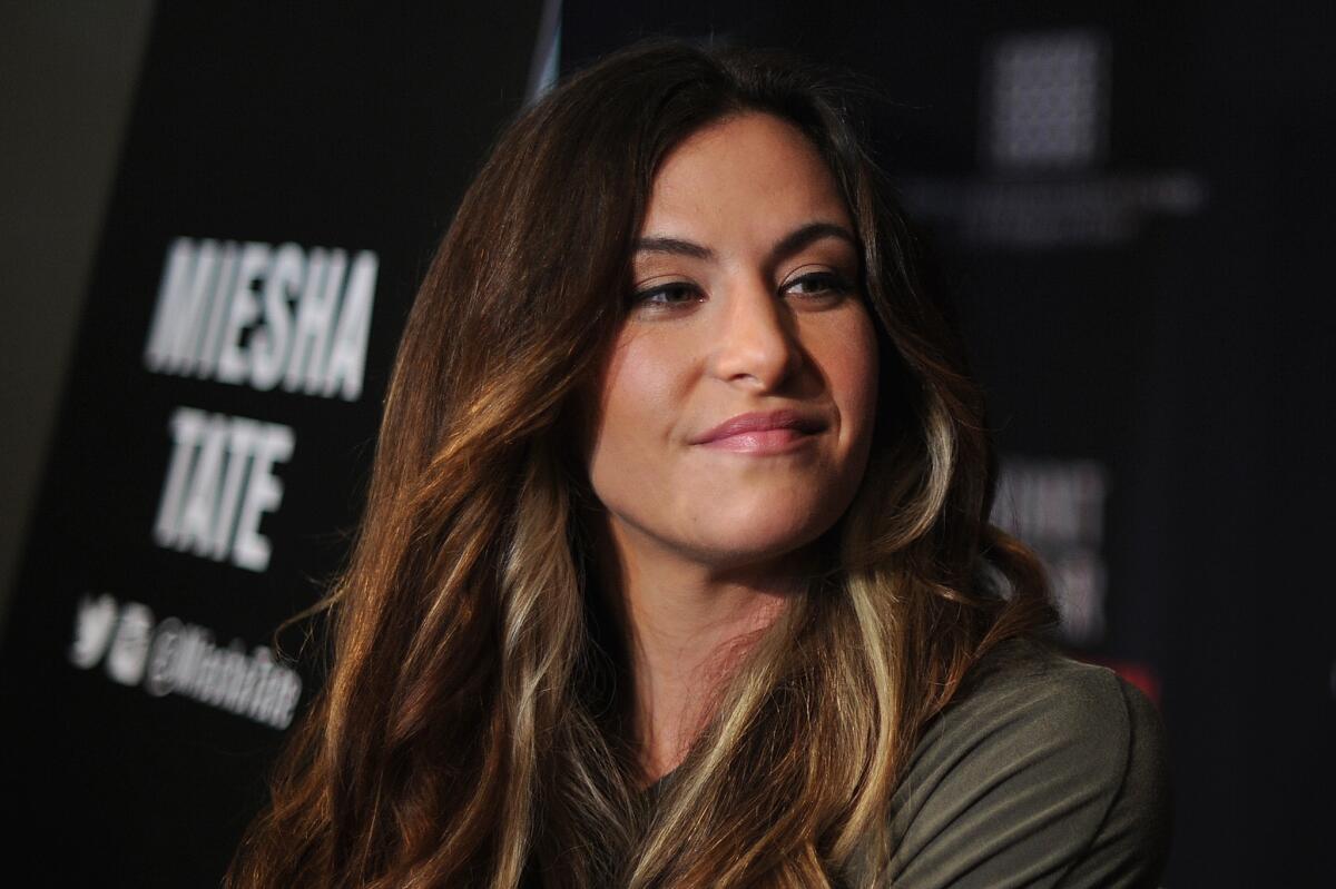 UFC women's bantamweight champion Miesha Tate speaks to media in Brisbane, Australia, on March 18.