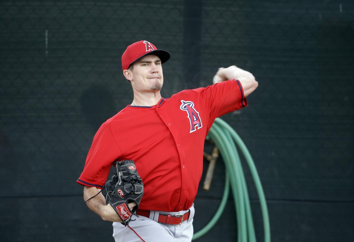 Newly acquired Angels pitcher Andrew Heaney throws during a spring training workout in Tempe, Ariz.