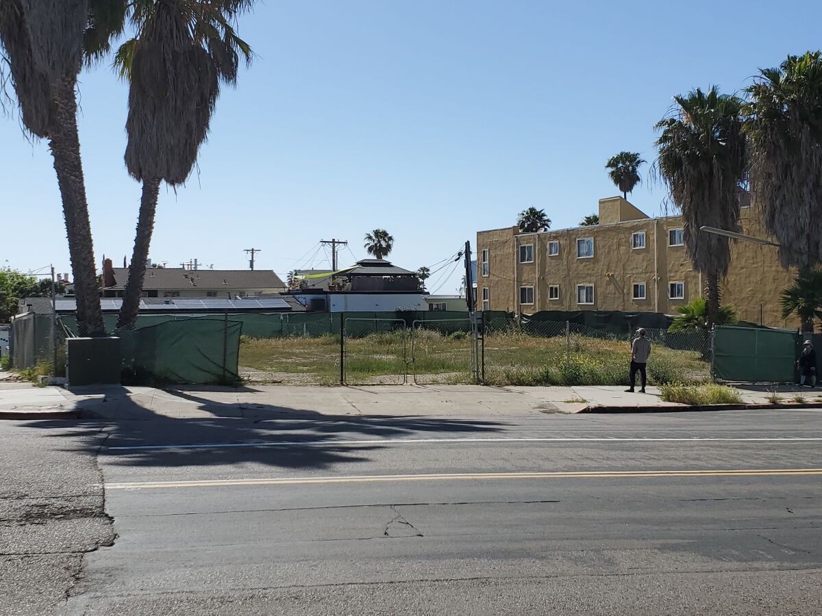 This vacant lot at La Jolla Boulevard and Gravilla Street is proposed for a 12-unit townhome development.