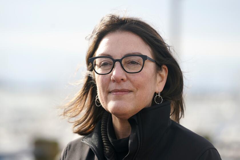 Rep. Suzan DelBene, D-Wash., listens to a question as she talks with media members about the opening of the U.S.-Canada border Monday, Nov. 8, 2021, in Blaine, Wash. The U.S. reopened its land borders to nonessential travel Monday after almost 20 months of COVID-19 restrictions. Travel across land borders from Canada and Mexico has been largely restricted to workers whose jobs are deemed essential. New rules will allow fully vaccinated foreign nationals to enter the U.S. regardless of the reason. (AP Photo/Elaine Thompson)