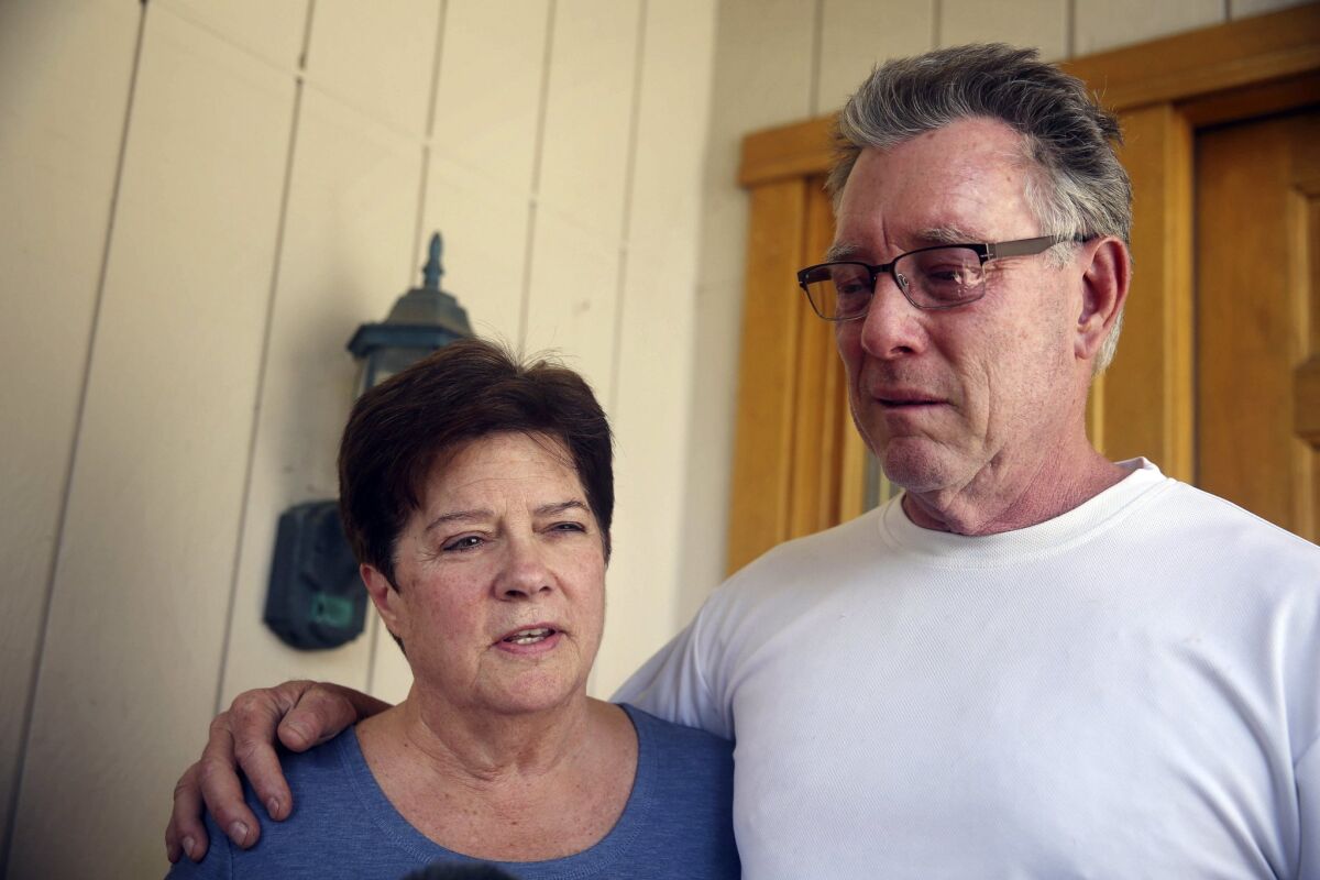 Liz Sullivan, and Jim Steinle, parents of shooting victim Kathryn Steinle, talk to reporters outside their home in Pleasanton, Calif.
