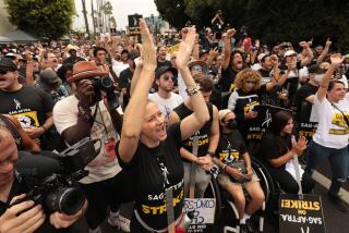 Los Angeles, CA - September 13: Paramount Studios Main Gate on Wednesday, Sept. 13, 2023 in Los Angeles, CA. Actor Jessika Fuhrmaneck cheers with members and supporters gathered at a rally of striking members of the SAG-AFTRA actors union as they gathered outside the Main Bronson Gate of Paramount Studios for a rally Wednesday morning in Hollywood. (Al Seib / For The Times)