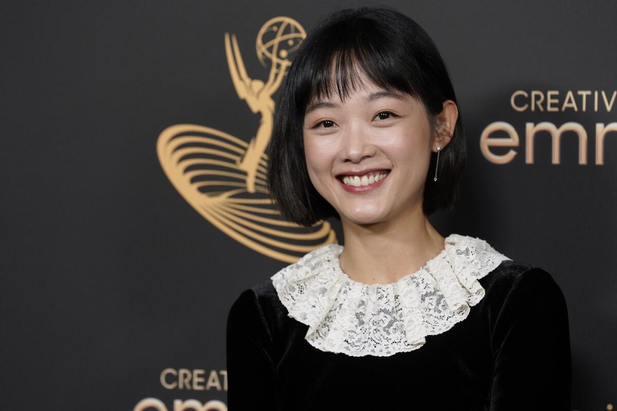 Lee Yoo-Mi poses in the press room with the award for outstanding guest actress in a drama series for "Squid Games" on night two of the Creative Arts Emmy Awards on Sunday, Sept. 4, 2022, at the Microsoft Theater in Los Angeles. (AP Photo/Chris Pizzello)