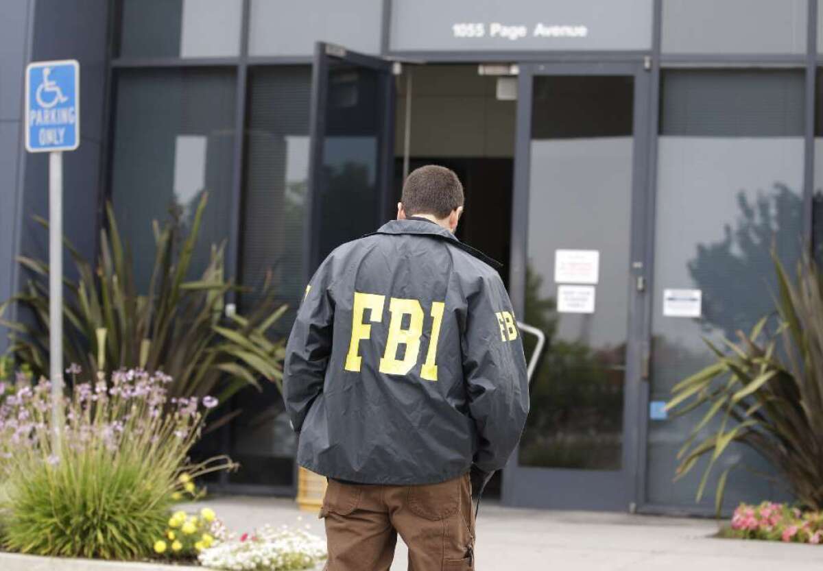 FBI agents arrested two people in an alleged $110-million Orange County Ponzi scheme.