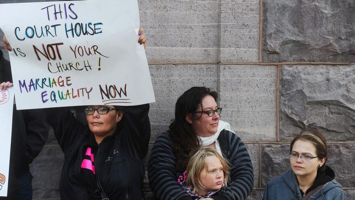 Same-sex marriage supporters rally outside the Federal Building and U.S. Courthouse in Sioux Falls, S.D., in October.