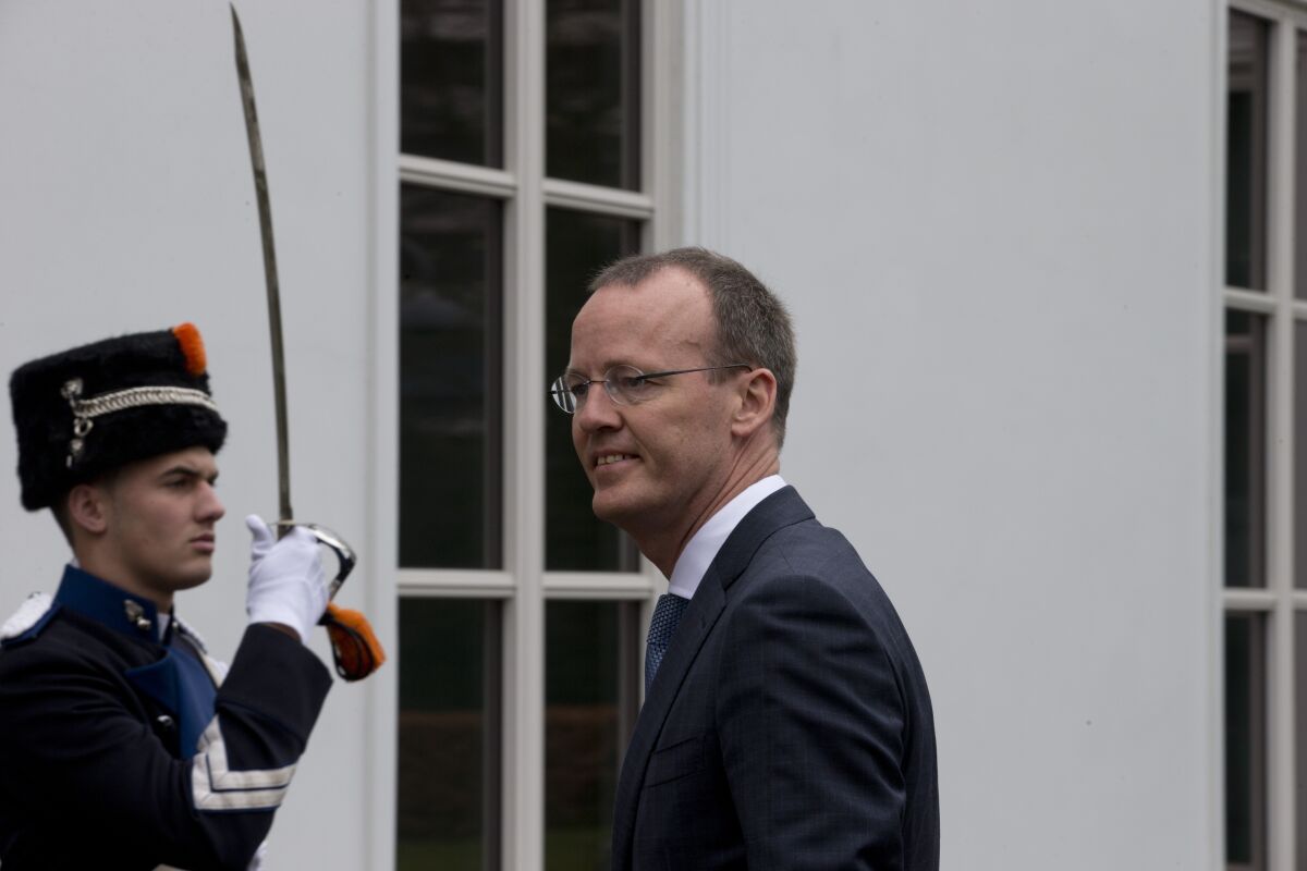 FILE - Dutch Central Bank President Klaas Knot, right, arrives at the Prime Minister's residence for a meeting with European Central Bank President Mario Draghi in The Hague, Netherlands, Monday April 15, 2013. Knot apologized Friday, July 1, 2022 for the institution's involvement in the 19th-century slave trade, the latest apology in the Netherlands linked to the country's historic role in the trade in enslaved people. (AP Photo/Peter Dejong, File)