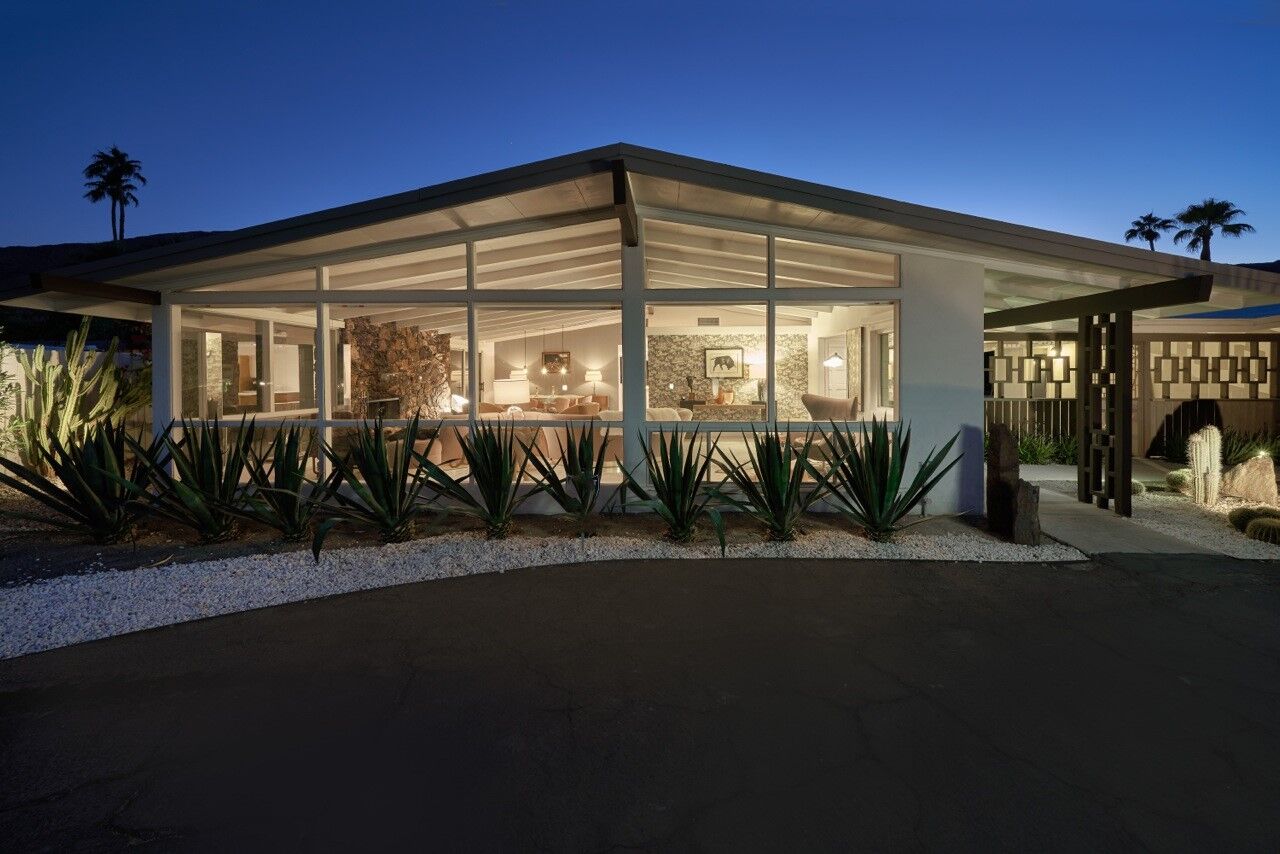 Desert landscaping surrounds the single-story home.