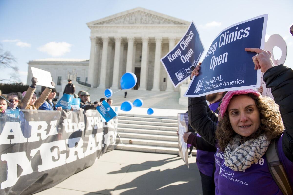 Both sides of the abortion debate rally outside the Supreme Court in a file photo.