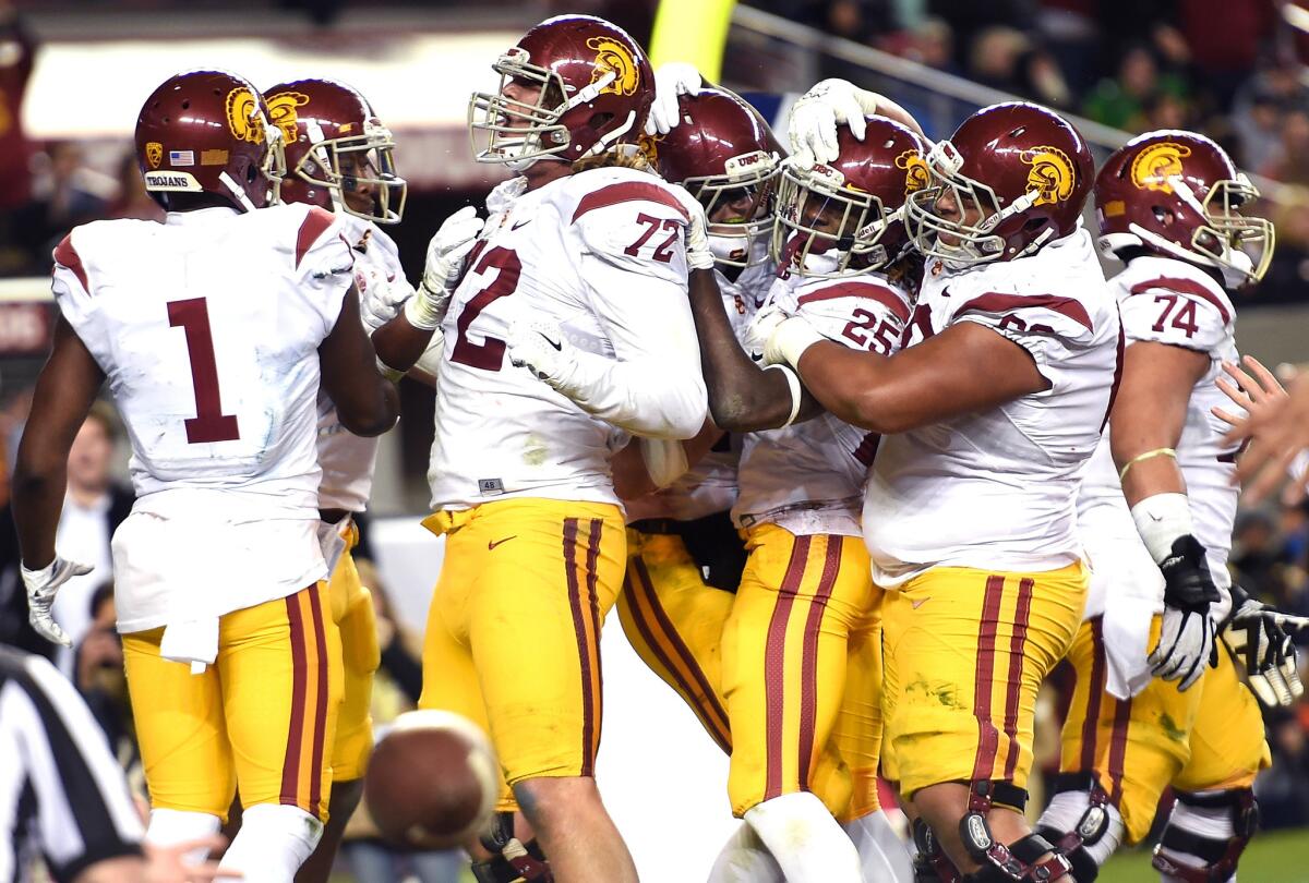 USC's Ronald Jones II celebrates with teammates after he scored a touchdown against Stanford during the third quarter of the Pac-12 Championship game at Levi's Stadium on Dec. 5.